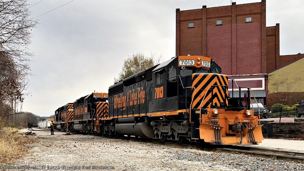 Wheeling crew is running around its train.